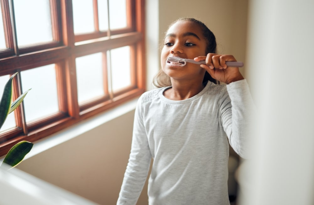 cloverdale girl brushing teeth